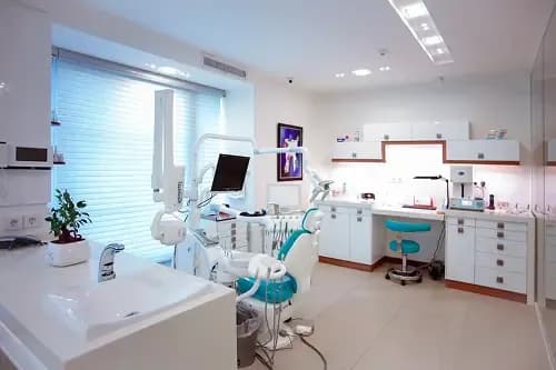 Friendly dentist and patient inside the Cleopatra Dental Riverside treatment room